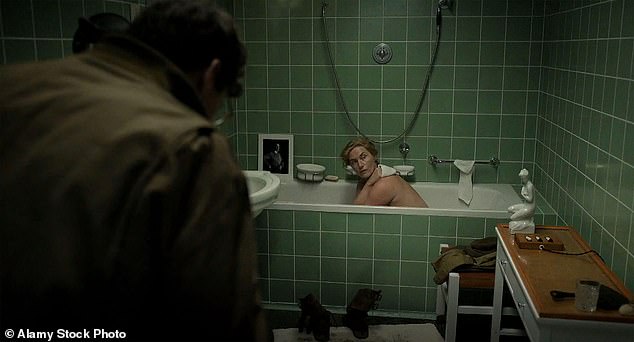 Kate recreated a scene in which war photographer Lee Miller posed naked in Hitler's bathtub in 1945 (pictured in the film Lee).