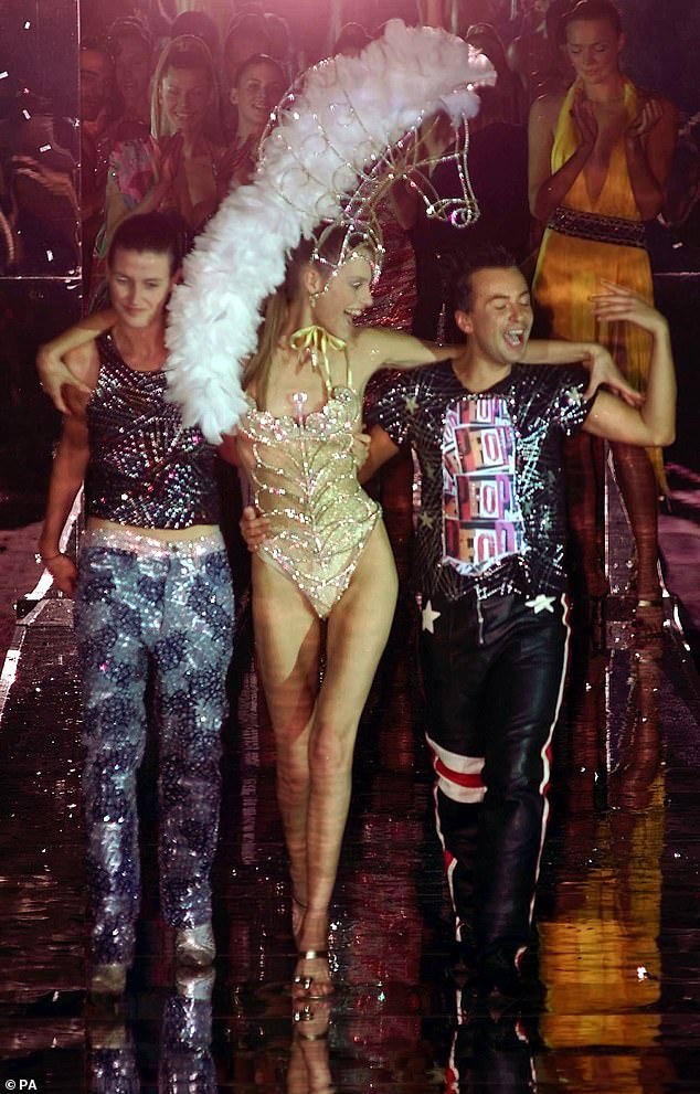 Georgina Cooper, center, walks with Julien MacDonald in 2000