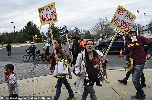 Protesters photographed in 2014, six years before the team left the 'Redskins'