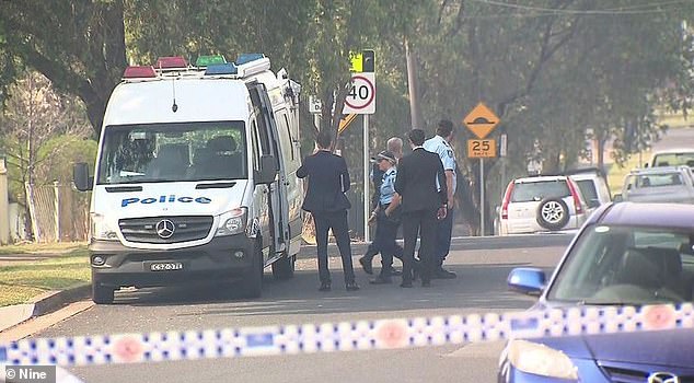 Mr Lembryk was stabbed twice after refusing to hand over the cash to the intruders (pictured, police and emergency services at the scene after the incident).