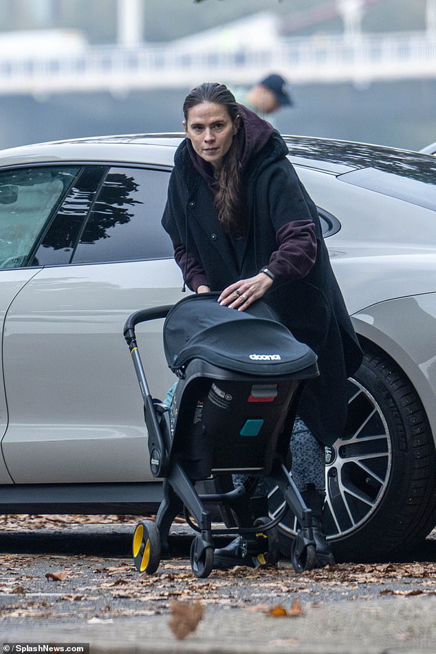 Hayley, sans make-up, looked totally comfortable in her new role and deftly placed the baby safely in her pram.