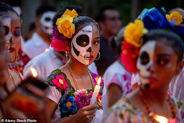 Above, a local girl participates in the annual Day of the Dead festival.