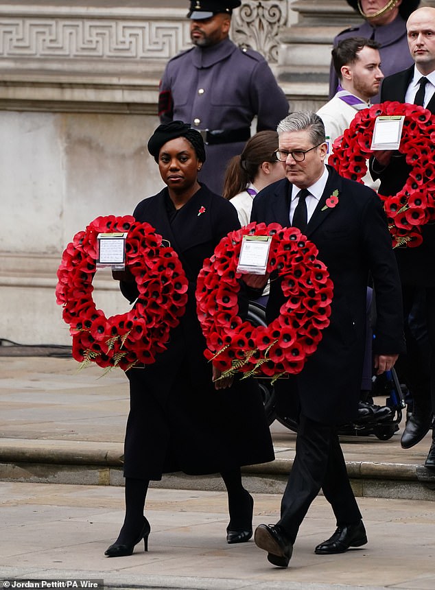 Opposition Leader Kemi Badenoch and Prime Minister Sir Keir Starmer wear wreaths during the Remembrance Sunday service at the Cenotaph.