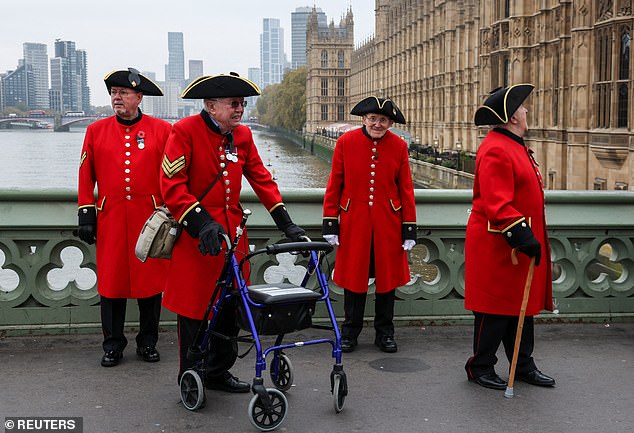 Chelsea pensioners were seen standing on nearby Westminster Bridge in London today.