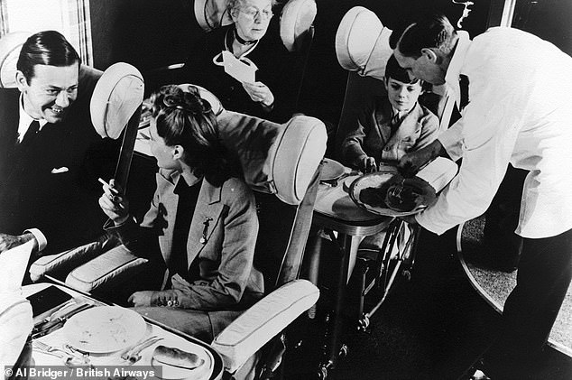 Passengers are served a meal on the Class C flying boat in the 1930s: 