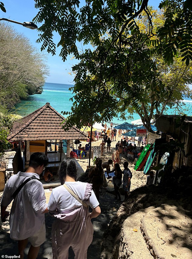 Padang Padang Beach in Uluwatu is a popular swimming and surfing spot for tourists (pictured)