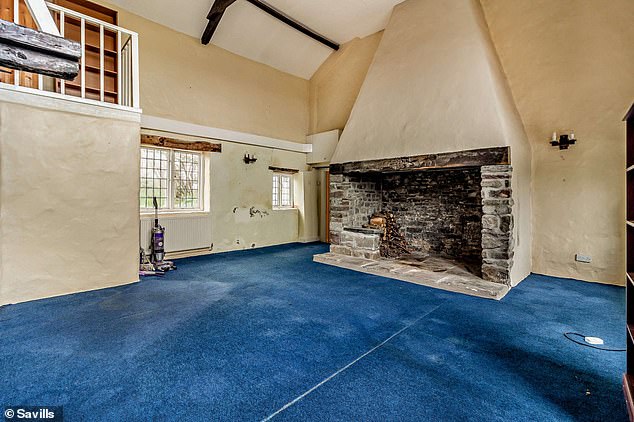 Features: There is a huge fireplace and beamed details in one of the rooms at Blue House Farm.