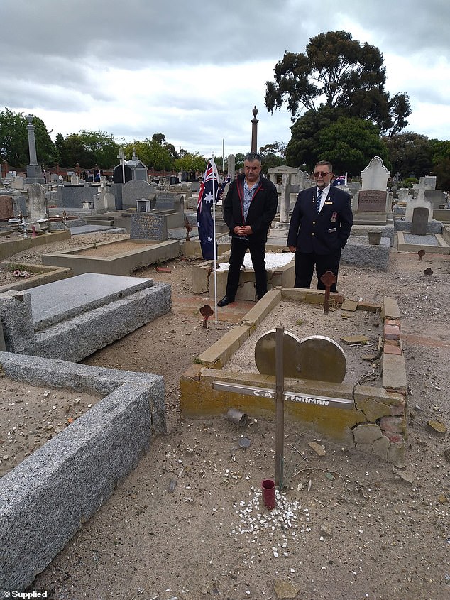 Peter Zabrdac (pictured left) attends a flag ceremony at William's grave with Victorian RSL State Committee member Ange Kenos.