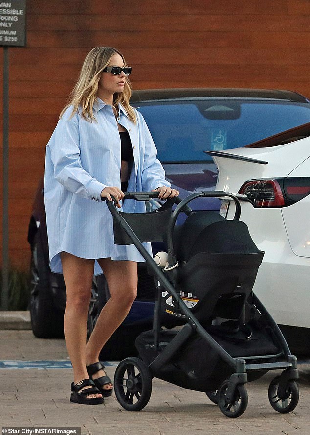 The proud new mom was photographed pushing her bundle of joy in a sleek black stroller.