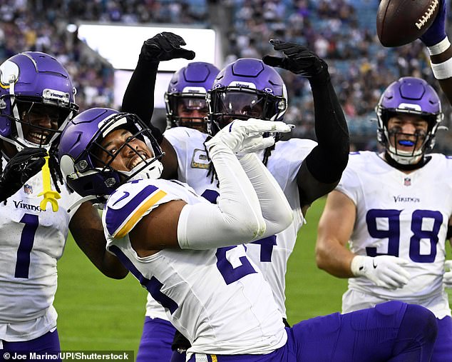 NFL star Camryn Bynu (pictured, center) imitated Raygun's routine when he scored a touchdown on Monday morning Australian time.