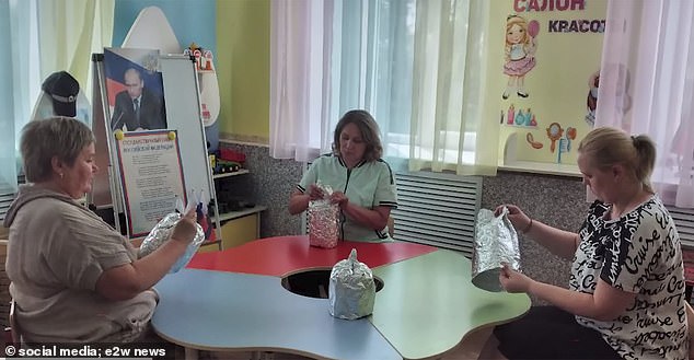 The teachers were informed in advance that they would be participating in a ¿large-scale patriotic event¿ that would require them to make aluminum foil hats.