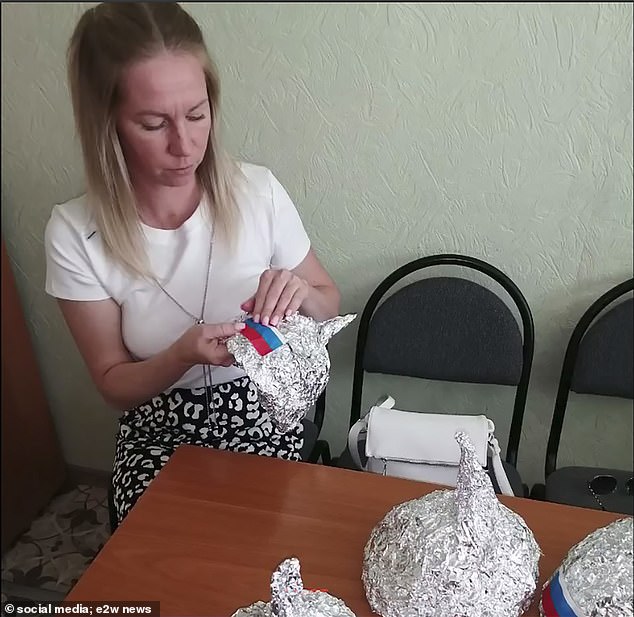 Several teachers jumped into the task and happily built their hats.