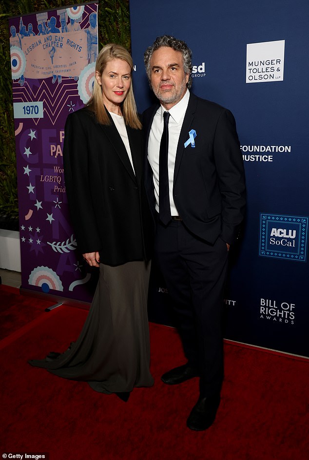 The Zodiac actor looked dapper in a black suit with slim lapels, a matching black tie and a classic white shirt. His wife Sunrise looked stylish in an oversized black sports coat over a white blouse and gray skirt.