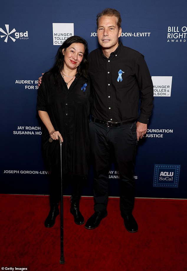 Iconic artist Shepard Fairey kept things simple in a black button-down shirt and matching pants. He was joined by his wife Amanda, who wore an almost identical outfit.