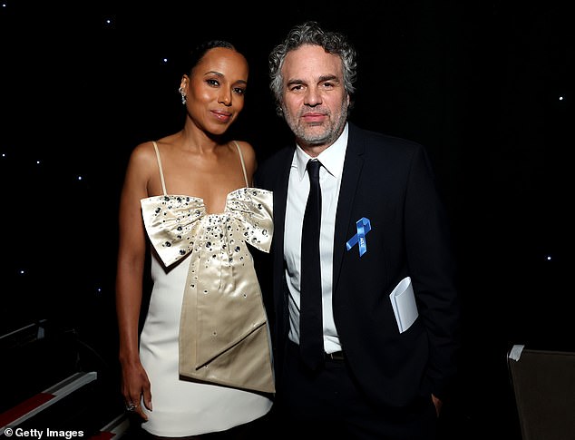 He also posed backstage with Kerry.