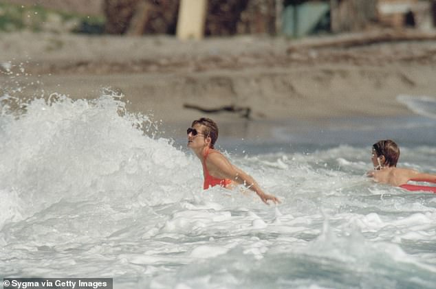 Diana enjoying the sea spray while on vacation with her two children in January 1993.