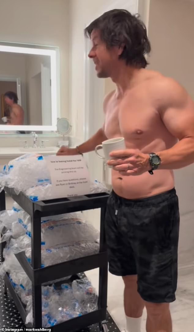 The shirtless Ted star was seen standing in a hotel bathroom before revealing a three-tier cart with ice packs stacked on top ready to be poured into the bathtub.