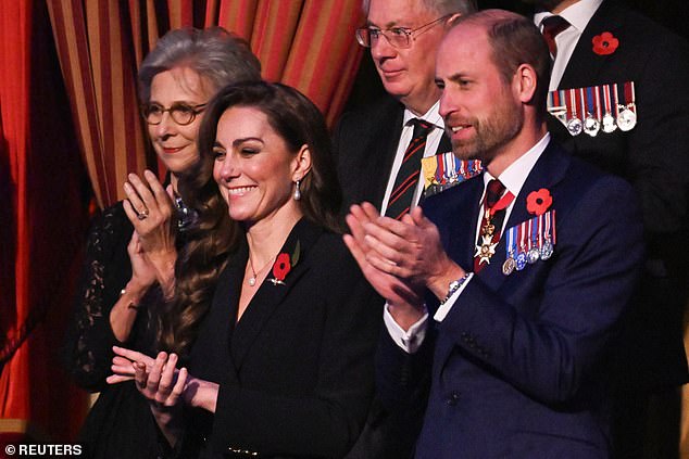 Kate cheered enthusiastically alongside her husband, Prince William, with the Duke and Duchess of Gloucester behind them.