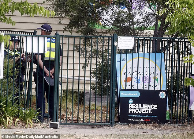 A kindergarten worker has died after a water tanker destroyed the Macedon Ranges Montessori preschool. In the photo the police appear at the scene.