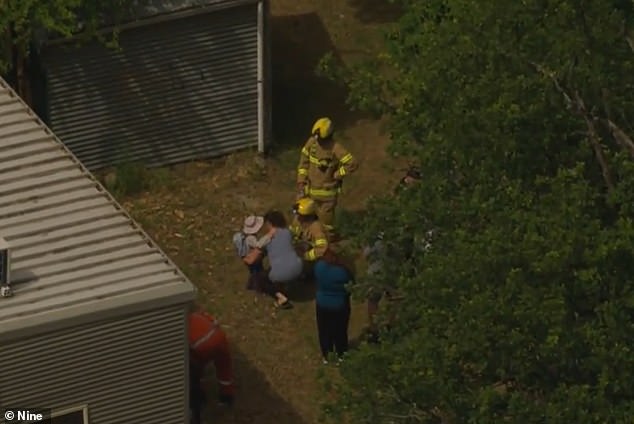 Concerned parents were initially separated from students by downed power lines, then could be seen hugging their children after crews cleared the danger.