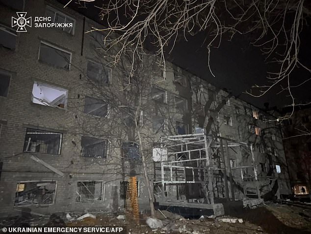 A residential building hit by a Russian airstrike in Zaporizhzhia this morning