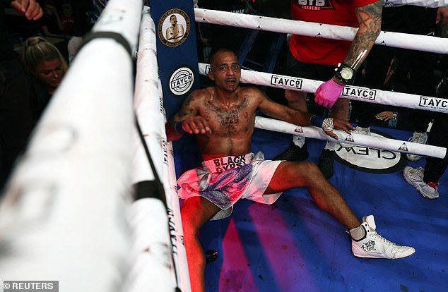 Nathan Massey lies in the corner of the ring after a loss on Friday.