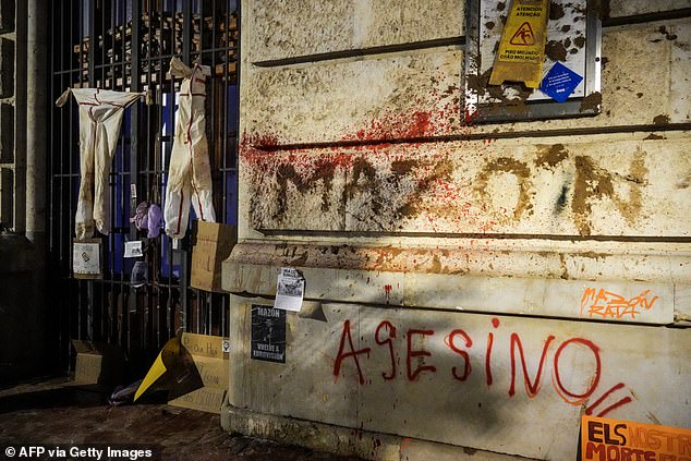 Graffiti is seen on the facade of the town hall during a demonstration to demand the resignation of Valencia regional president Carlos Mazón in Valencia on November 9, 2024.