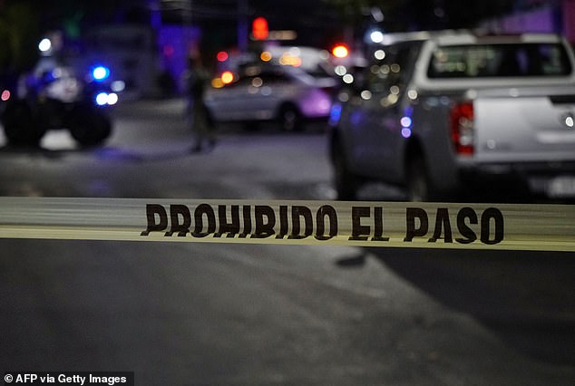 Police tape to prevent access to the crime scene outside the Los Cantaritos bar