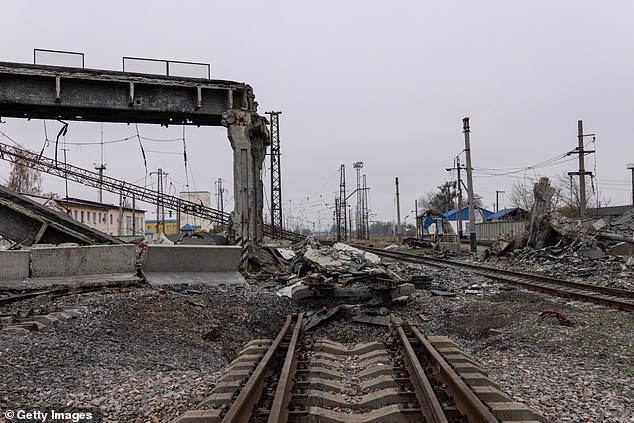 Debris from a destroyed bridge lies on severely damaged train tracks on November 10, 2024, in Pokrovsk, Ukraine.