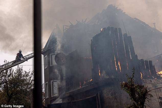 Ukrainian firefighters respond to an artillery attack on November 10, 2024 in Pokrovsk, Ukraine.