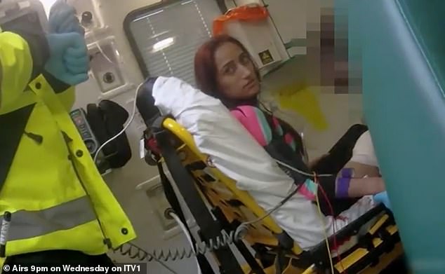 Ahmed sitting in an ambulance after stabbing herself in the leg in an attempt to frame her ex-lover.