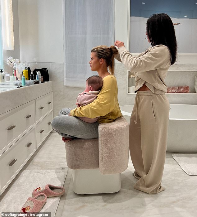 Richie took to Instagram to share a sweet photo of herself looking glam for the event with her baby Eloise sitting on her lap during the process.