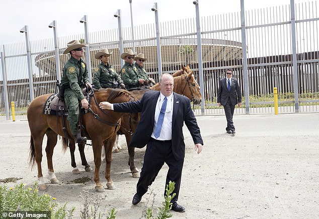 Homan speaks with Border Patrol agents along the southern border wall in San Ysidro, California, on May 7, 2018.