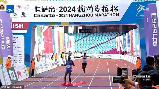 Both men quickly realize their mistake and race towards the finish line, but with Mr. Kibet now in the lead, who then takes first prize with a time of 2:07:47.