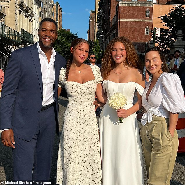 The former Giants star photographed with his daughters Sophia (second from left) and Isabella (third from left) along with his girlfriend Kayla Quick (right).