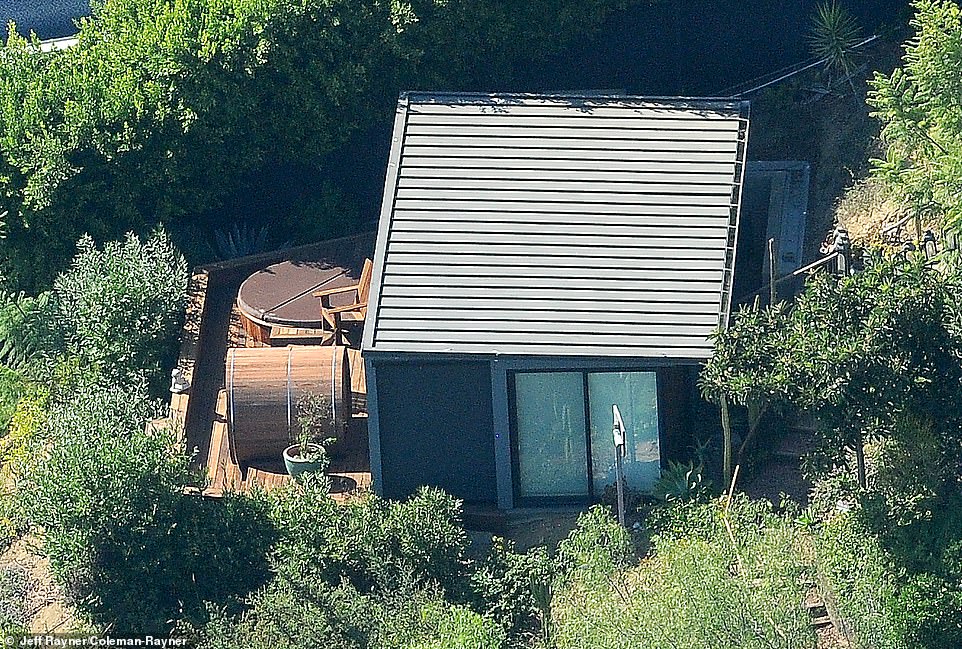 There's a personal spa getaway at the base of your hillside home, featuring a sunken hot tub built into the pool, private one-person sauna, and relaxing cedar wood chair.