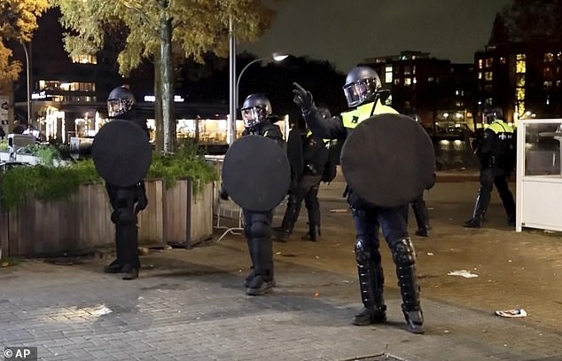 Riot police as Amsterdam's mayor banned all demonstrations in the city on Monday.