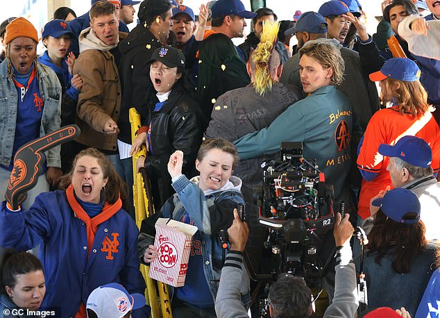 They were also seen on a busy train platform surrounded by New York Mets fans dressed in the team's blue and orange.