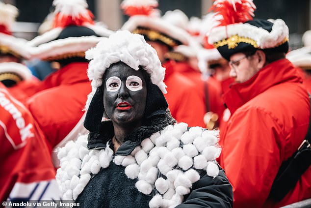 She was also seen with pieces of cotton stuck to her outfit while attending the opening of the traditional Dusseldorf Carnival season on November 11.