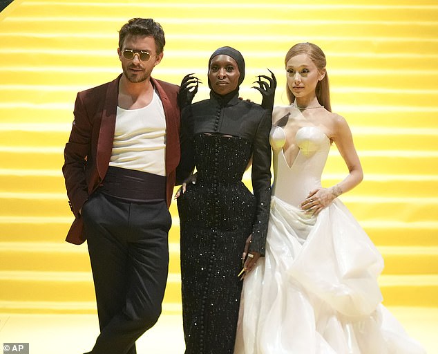 At the event, she posed alongside her co-stars Cynthia Erivo and Jonathan Bailey, who wrapped their arms around her petite figure.