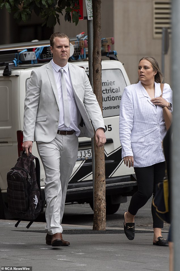 Officer White was supported by his wife in court on Tuesday (both pictured)