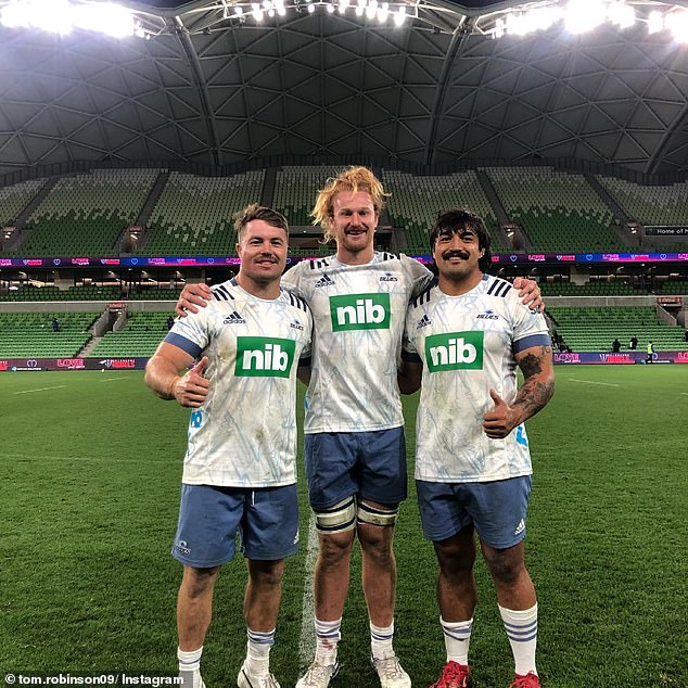 Robinson (pictured center with teammates) said his concussion symptoms got so bad he hoped he wouldn't get a call-up to play for the All Blacks.