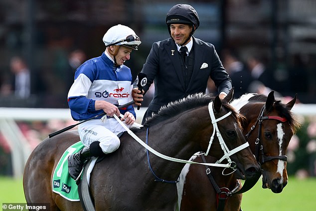 McDonald, pictured speaking to NRL legend and horse racing reporter Billy Slater, won more than $320,000 in four days at the Melbourne Cup Carnival.