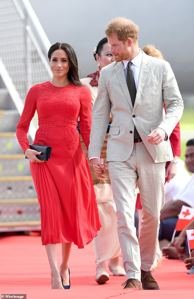 Meghan turned heads when she arrived with Prince Harry in Tonga in October 2018, wearing a demure £380 dress from Self-Portrait.