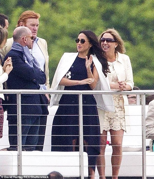 Meghan watches Harry take part in a game of polo at Coworth Park in Berkshire in 2017