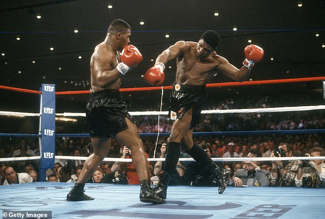 Tyson became the undisputed world champion in 1988, adding The Ring and lineal titles to his collection after knocking out Michael Spinks in the first round (pictured demolishing Trevor Berbick in 1986).