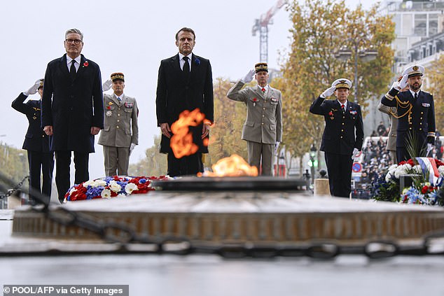 Keir Starmer and Emmanuel Macron stand today at the Tomb of the Unknown Soldier on the Place de l'Etoile in Paris.