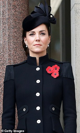 Velvet bow and buttons. First worn: Remembrance Day 2020. Originally, this Catherine Walker coat had a high collar, shoulder tassels, and shiny metal buttons. All military-inspired details have now been removed.