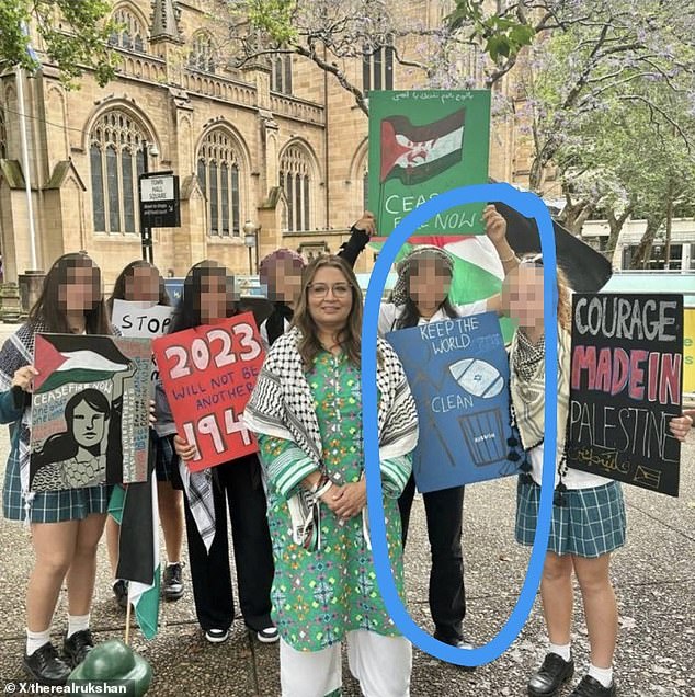 Federal Greens deputy leader Mehreen Faruqi posed in a photograph next to a sign that read 