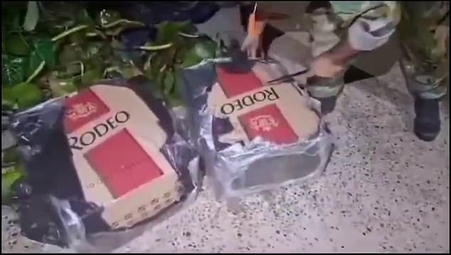 Police discovered he had been stuffing 200 packets of 'Rodeo King Size' cigarettes into four black boxes.